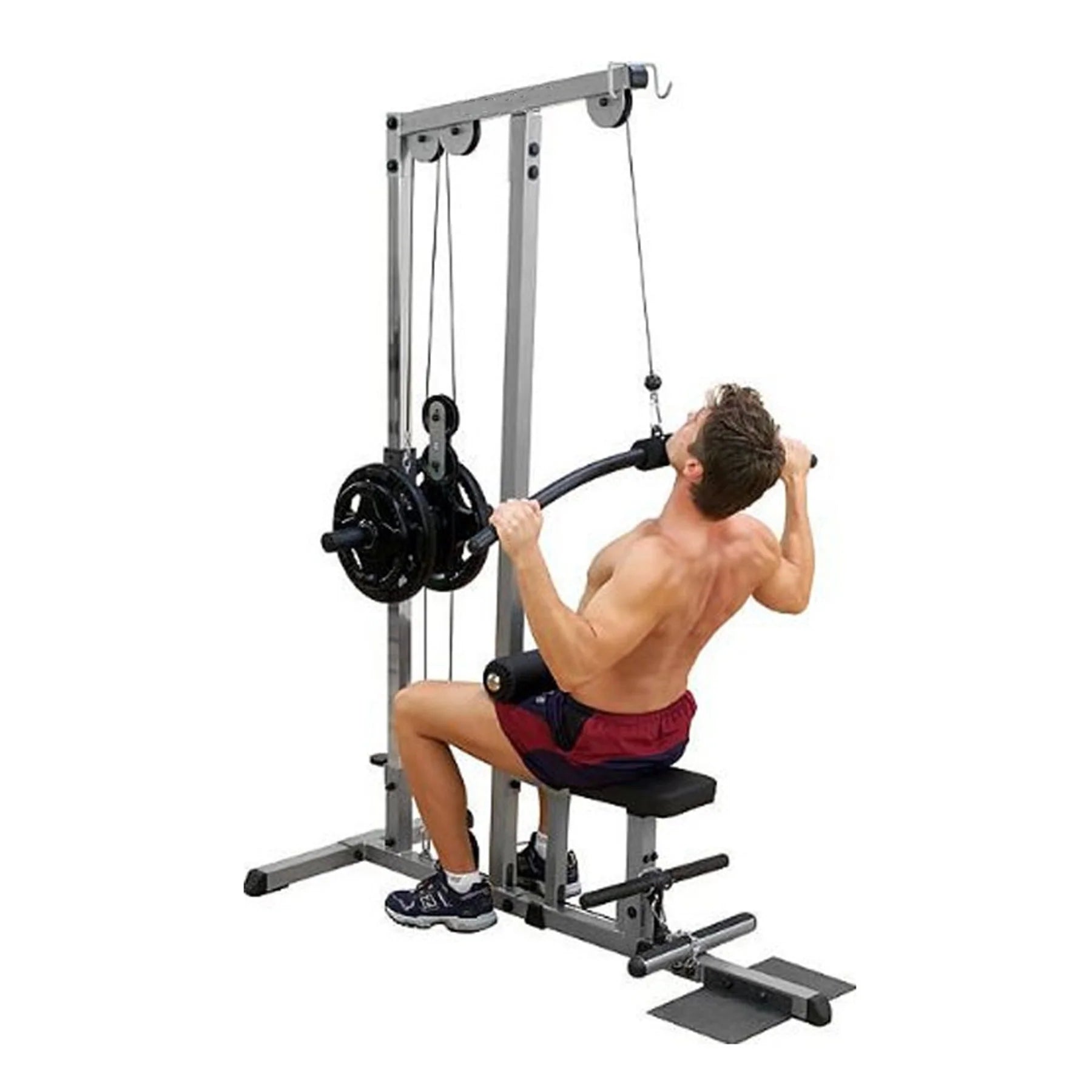 Man using a cable machine in a gym setting