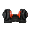 Black and orange adjustable dumbbell on a white background