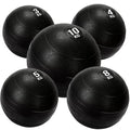 Set of black weighted exercise balls with varying weights on a white background