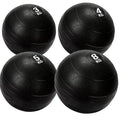 Four black exercise balls with weight markings on a white background