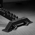 Black metal car jack stand on a textured gray surface