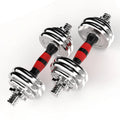 Pair of chrome dumbbells with red and black resistance bands on a white background