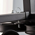 Close-up of a mechanical component with a metallic finish on a blurred background