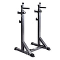 Pair of black and silver weight rack stands on a white background