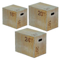 Three wooden exercise boxes with height markings on a white background