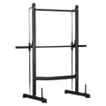 Black metal fitness power rack on a white background