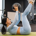Woman exercising with a medicine ball in a home setting