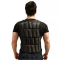 Person wearing a black weighted vest on a white background